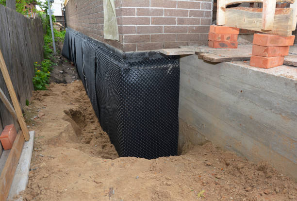 Happy homeowners after waterproofing job in Farmington
